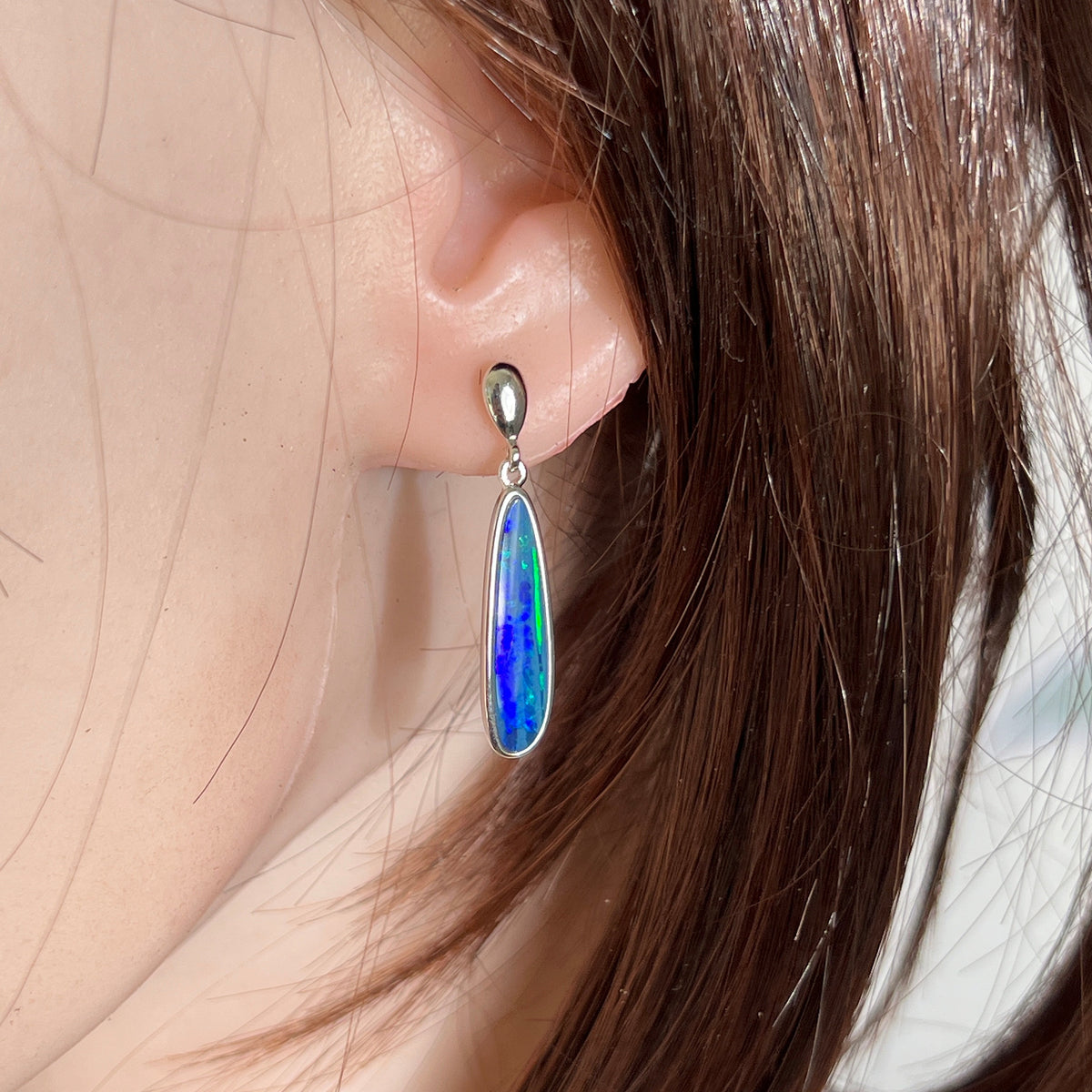 23 x 6mm freeform Australian opal doublet earrings worn on the ear, sterling silver