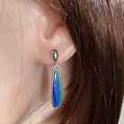 Australian opal doublet earrings worn on the ear, sterling silver, 23 x 6mm freeform stones