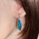 Worn Australian opal doublet earrings in sterling silver, blue and green, 24 x 8mm