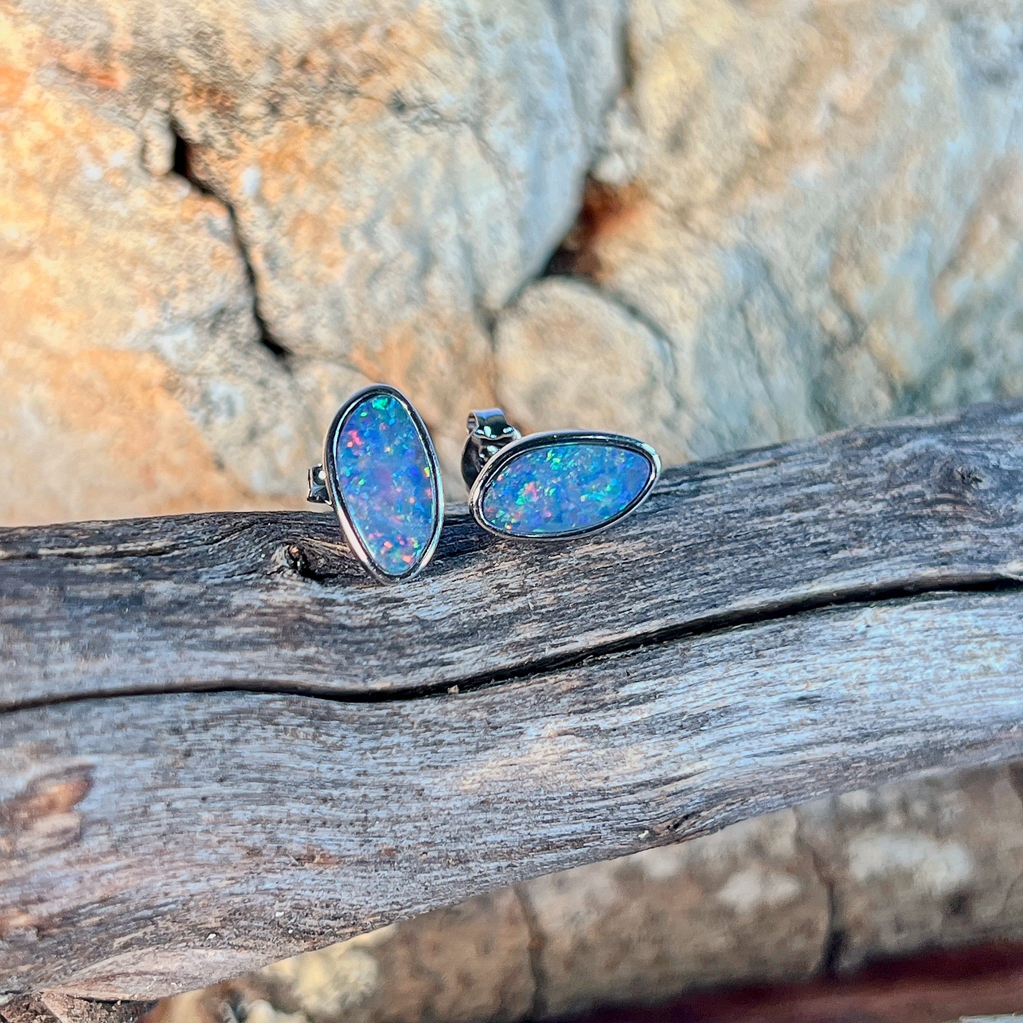 red, blue, yellow and green play-of-colour in 12 x 6mm freeform Australian opal doublet earrings