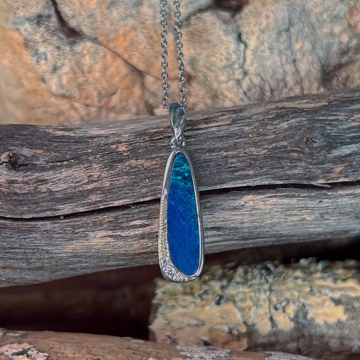 sterling silver Australian opal doublet pendant with a 20 x 6mm oval stone