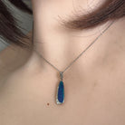 Worn Australian opal doublet pendant in sterling silver, blue and green, 20 x 6mm
