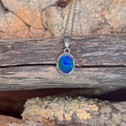 oval Australian opal doublet pendant in sterling silver, blue, green and red play-of-colour