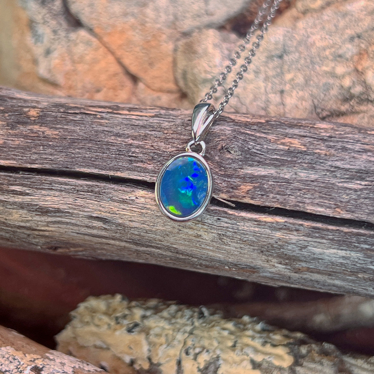 sterling silver Australian opal doublet pendant with a 9.5 x 7mm oval stone
