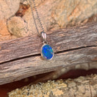 blue, green and red play-of-colour in a 9.5 x 7mm oval Australian opal doublet pendant