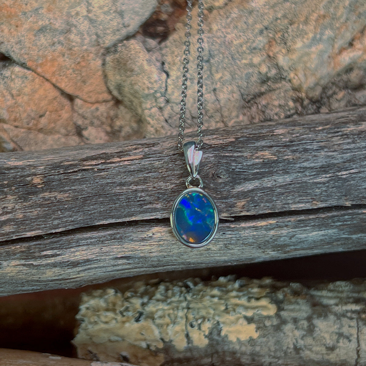 9.5 x 7mm Australian opal doublet pendant in sterling silver, blue, green and red
