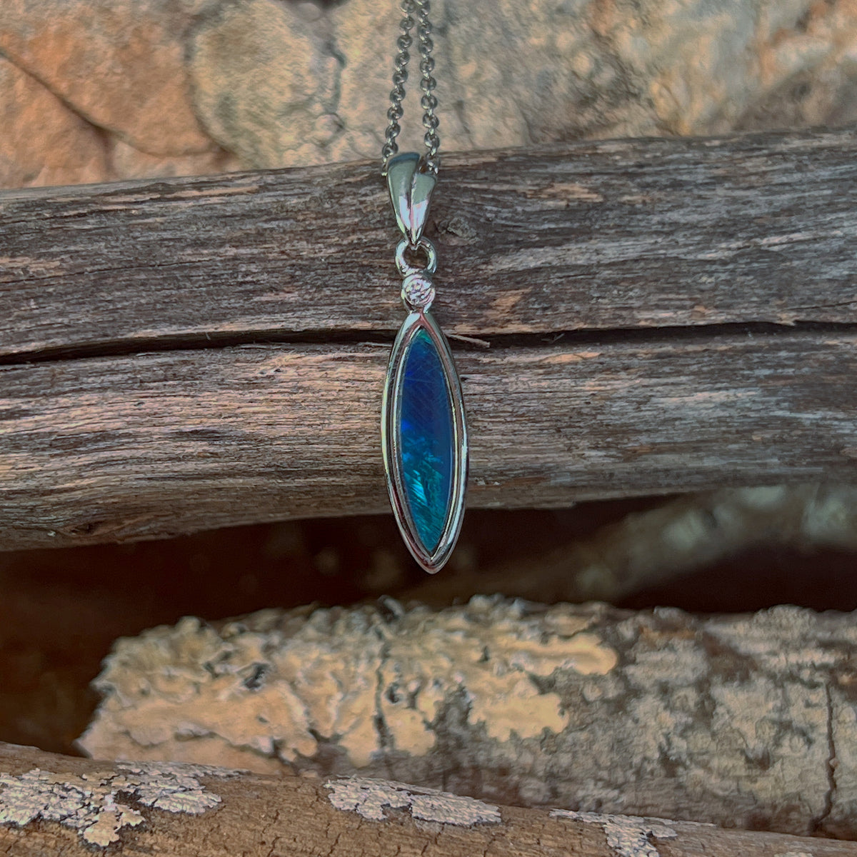 sterling silver Australian opal doublet pendant with a 16 x 5mm oval stone