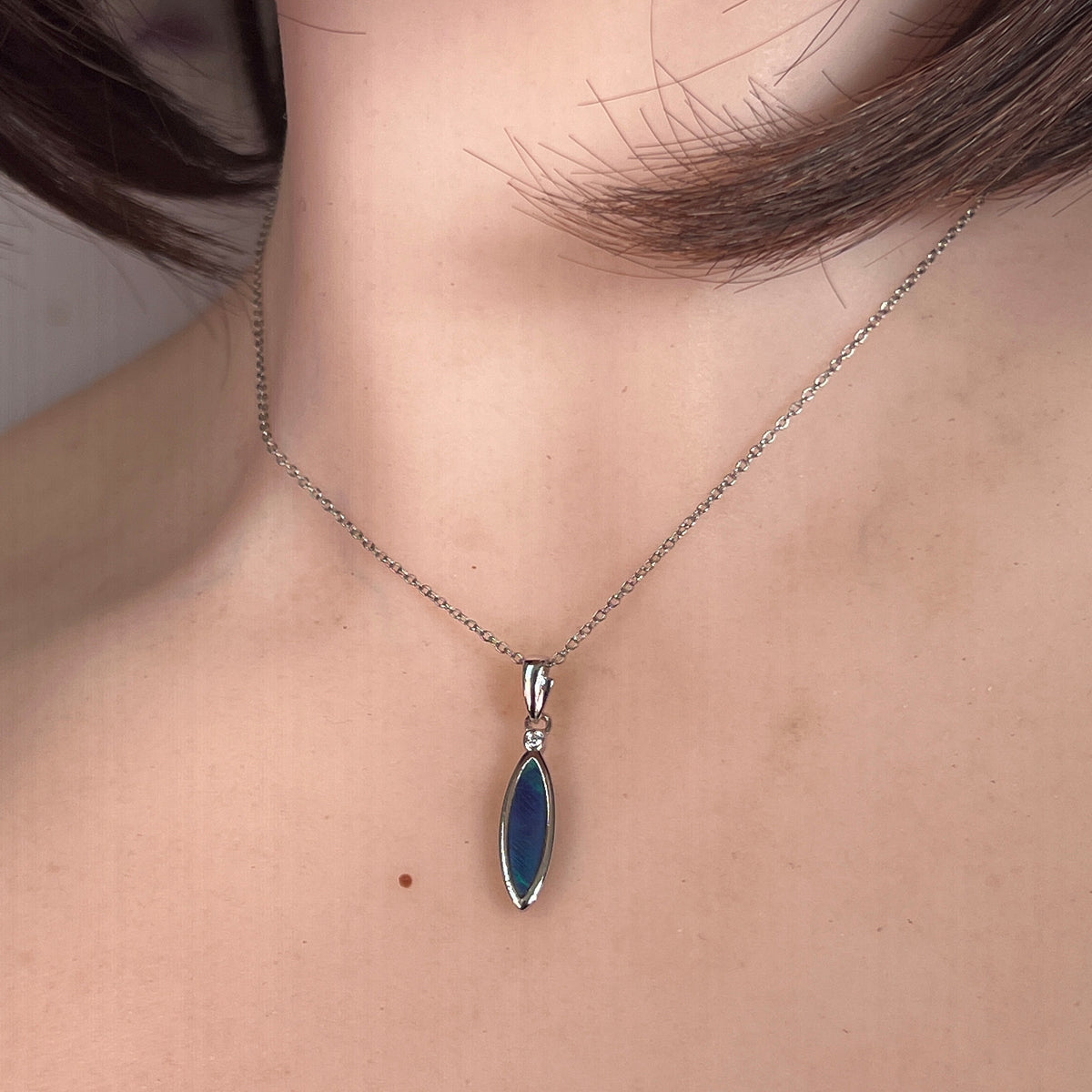 Worn Australian opal doublet pendant in sterling silver, blue and green, 16 x 5mm