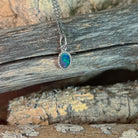 red, blue and green play-of-colour in a 7 x 5mm oval Australian opal doublet pendant