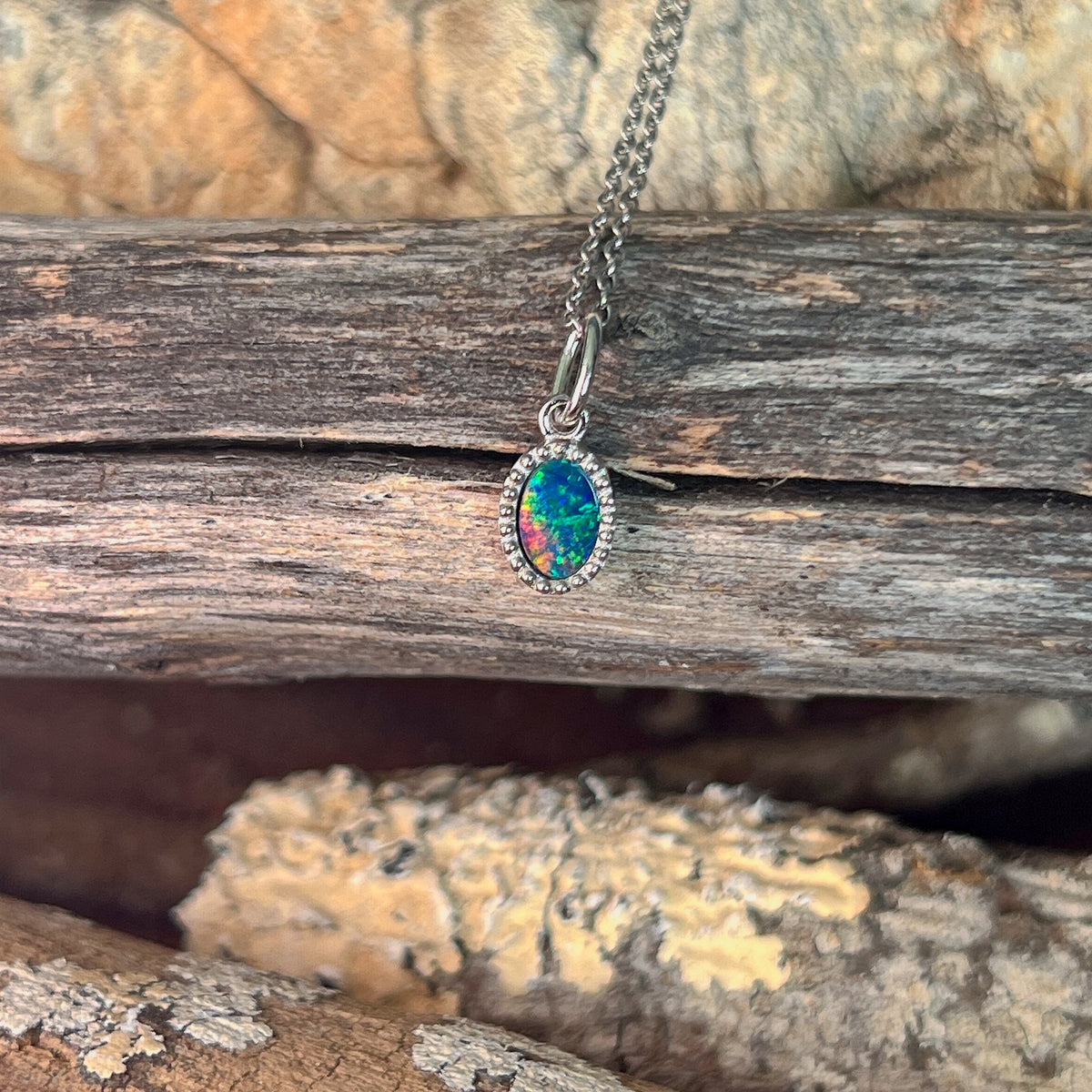 7 x 5mm Australian opal doublet pendant in sterling silver, red, blue and green
