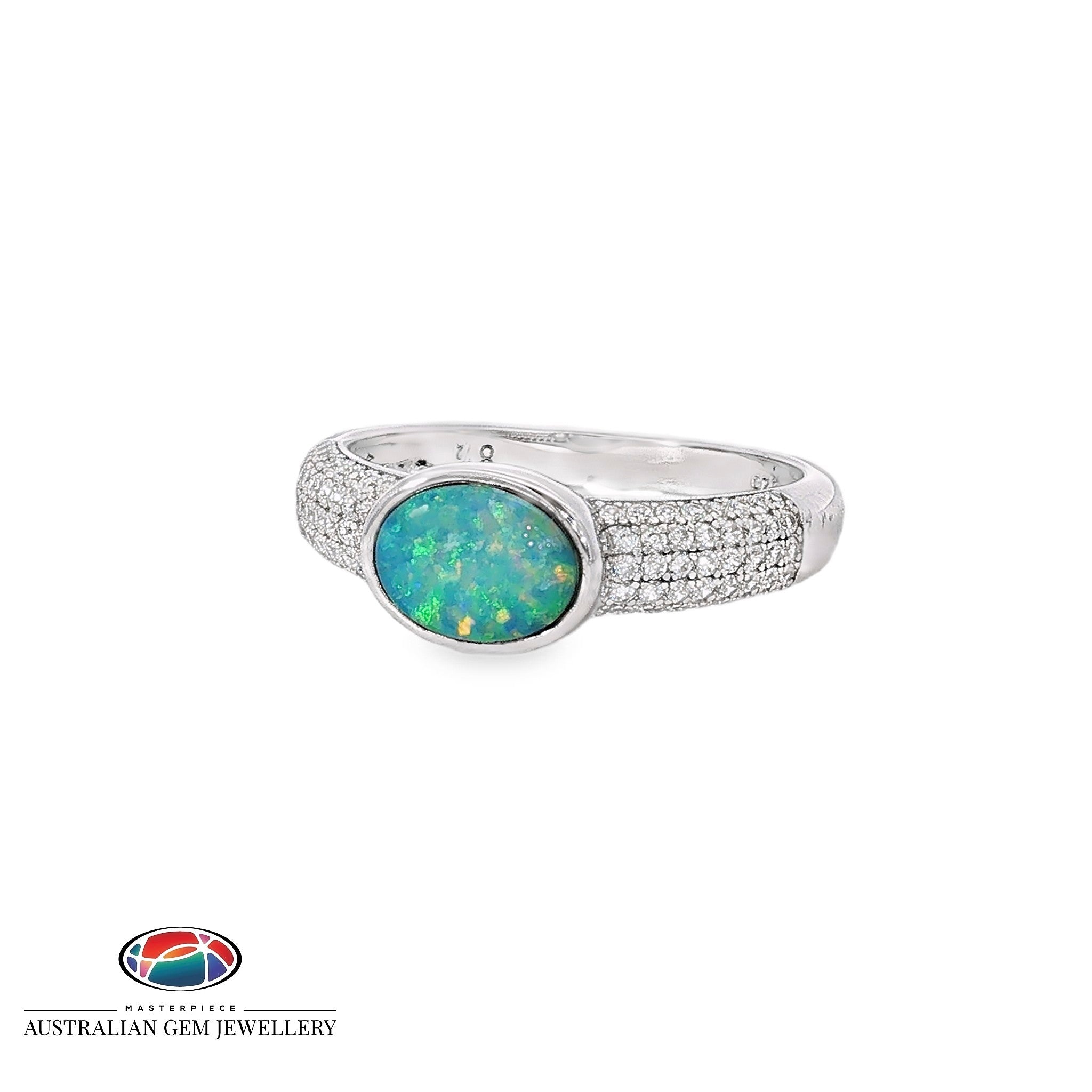 Oval opal doublet ring in sterling silver on a band pave set with cubic zirconia, showing blue, red and green play of colour