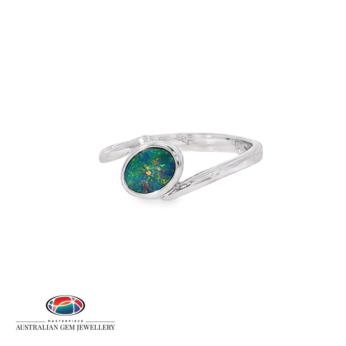 Oval opal doublet set on a slant in a sterling silver split-shank ring, showing blue, red and green play of colour