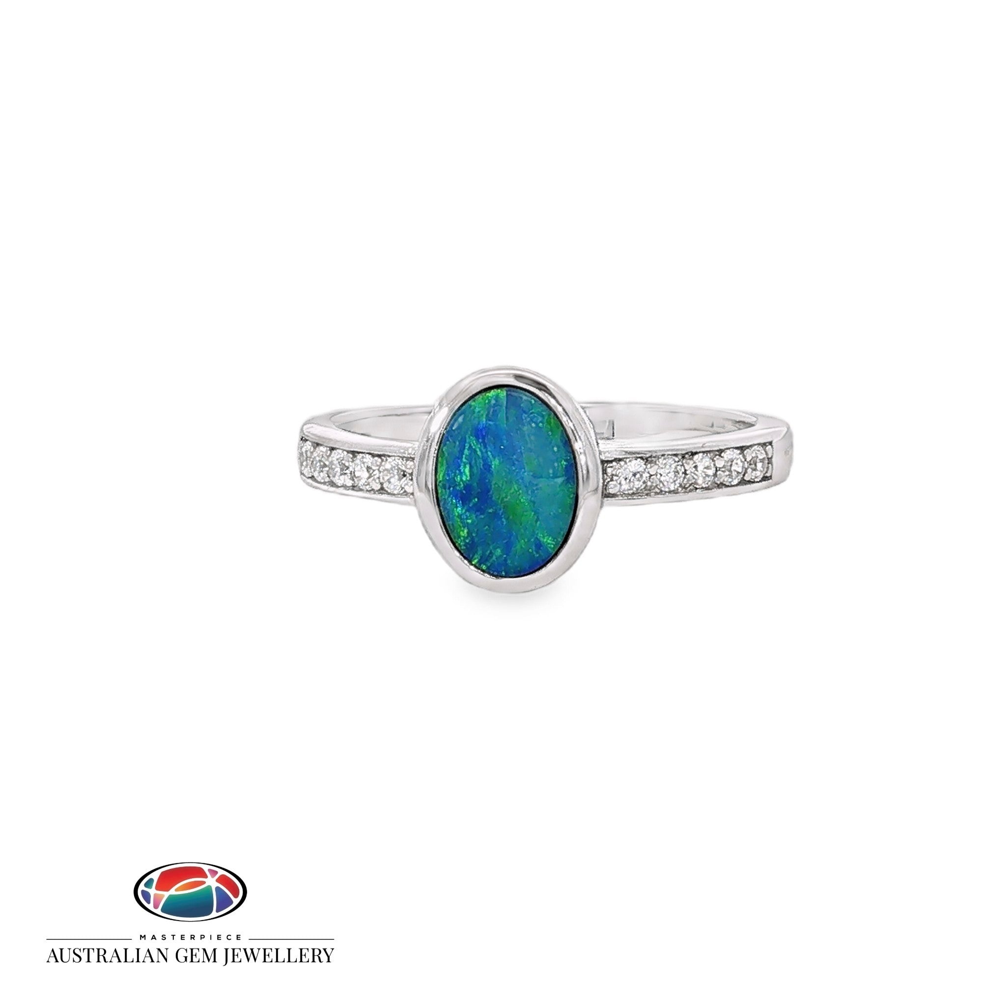Oval opal doublet ring in sterling silver with cubic zirconia set along each shoulder, showing blue, red and green play of colour
