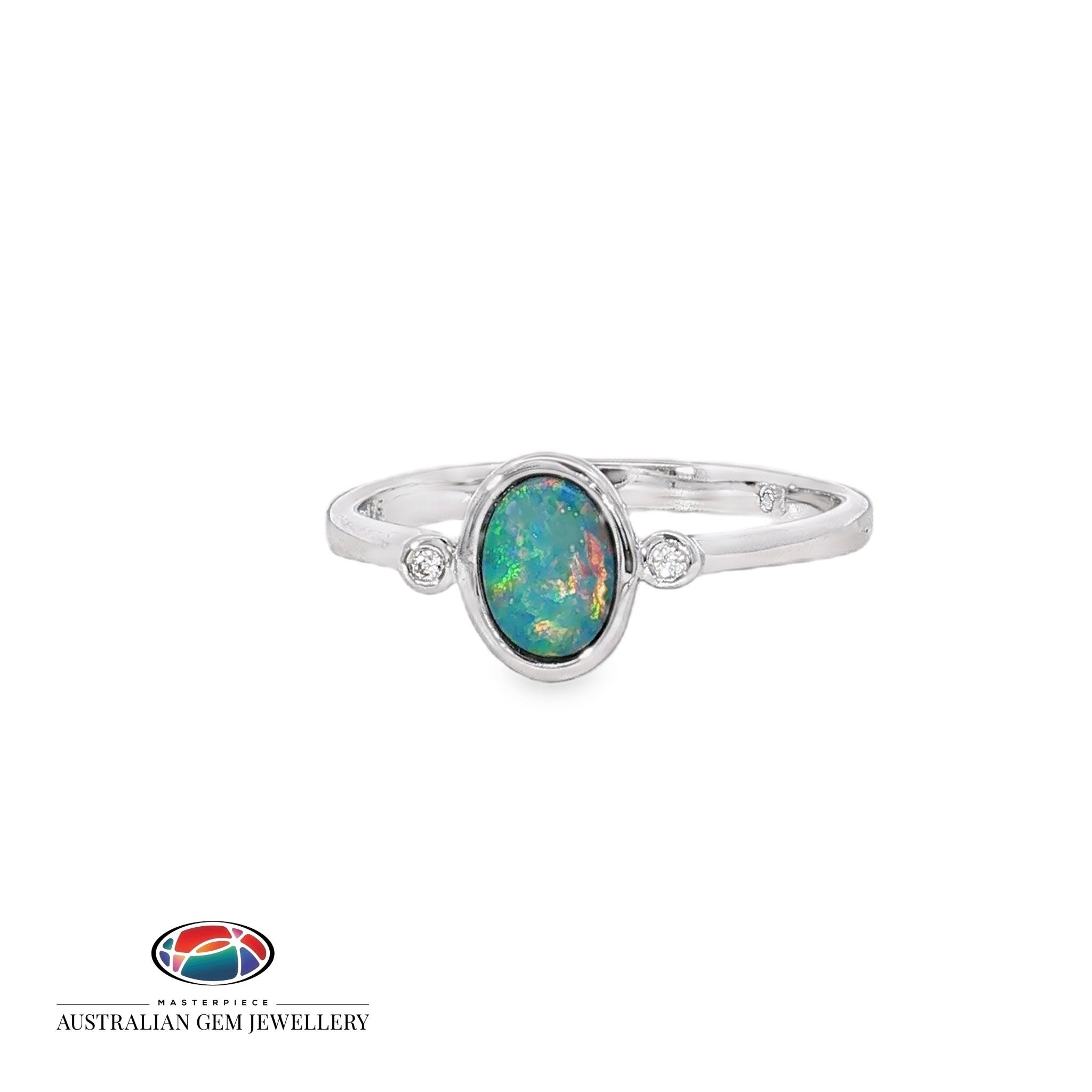 Oval opal doublet ring in sterling silver with a cubic zirconia to each side, showing blue, red and green play of colour