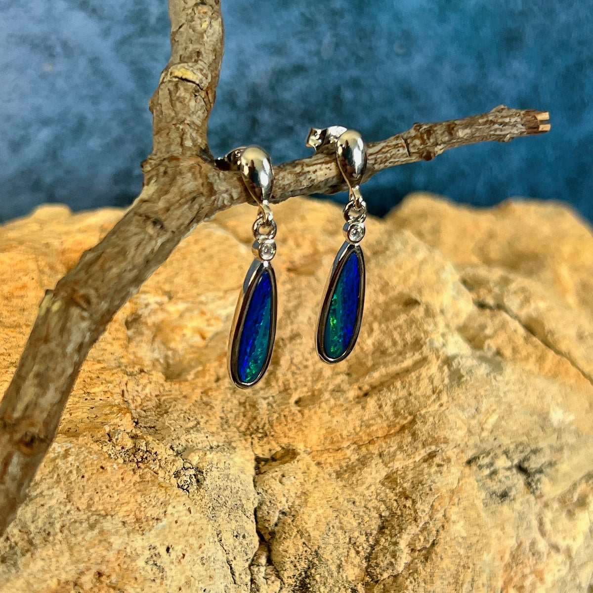 blue and green play-of-colour in 15 x 5mm pear-shaped Australian opal doublet earrings