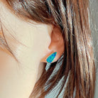 Sterling silver teardrop opal doublet stud worn on the ear, side profile view
