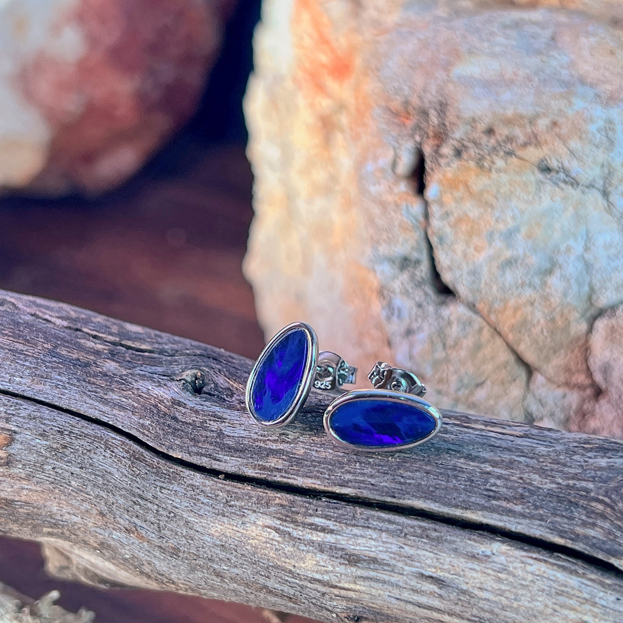 blue and black play-of-colour in 11 x 6mm pear-shaped Australian opal doublet earrings