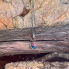 round Australian opal doublet pendant in sterling silver, red, blue and green play-of-colour