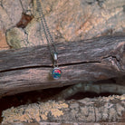 sterling silver Australian opal doublet pendant with a 5mm round stone