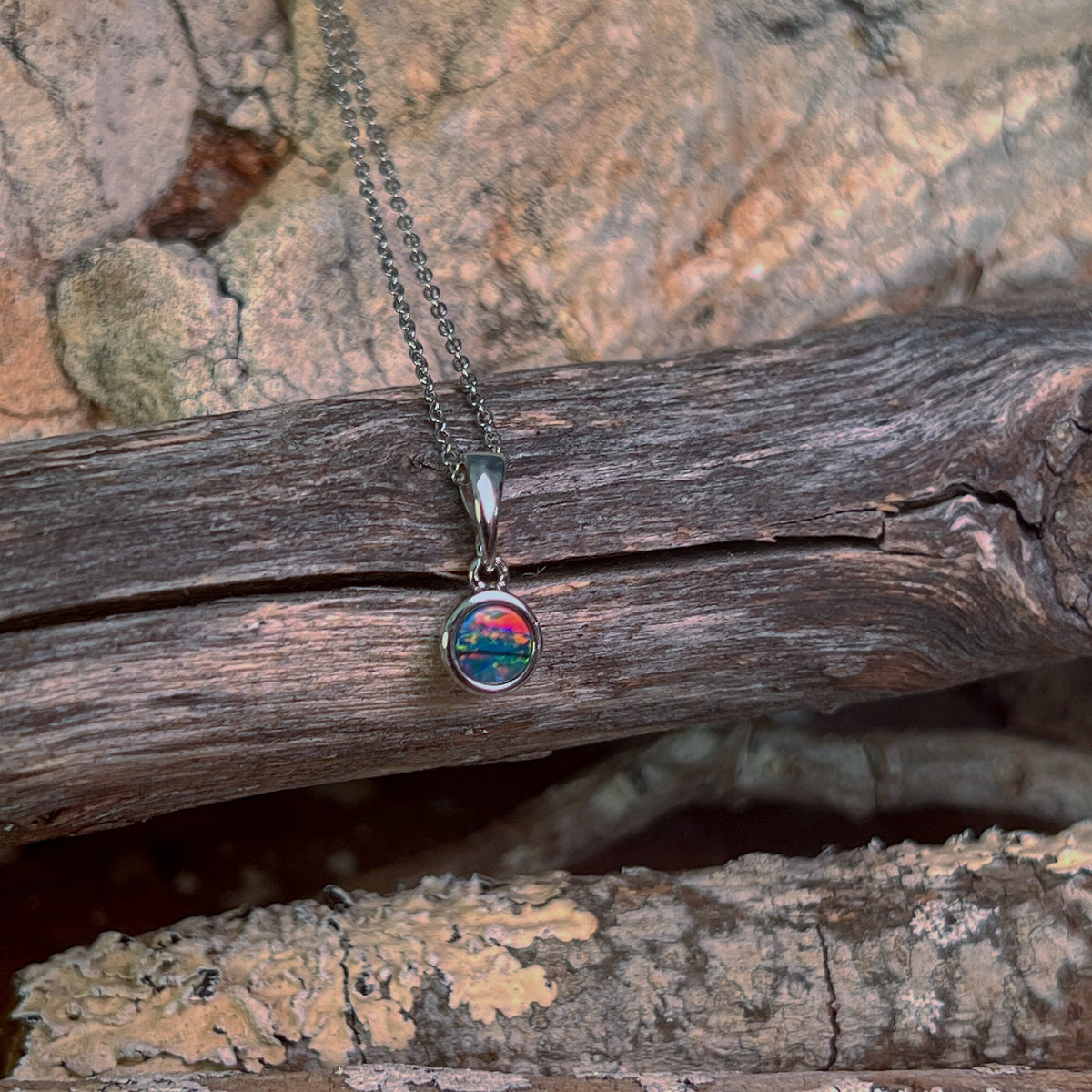 sterling silver Australian opal doublet pendant with a 5mm round stone