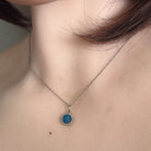 Australian opal doublet pendant worn at the neck, blue and green play-of-colour