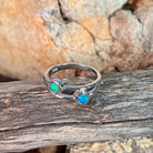 Close view of the blue and green play of colour in the round opal doublet