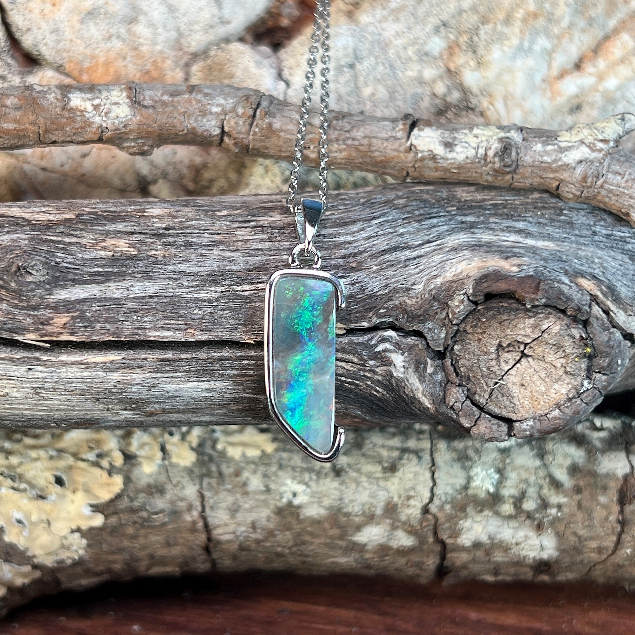 Australian boulder opal pendant, sterling silver, 18 x 7mm stone showing brown, green and blue