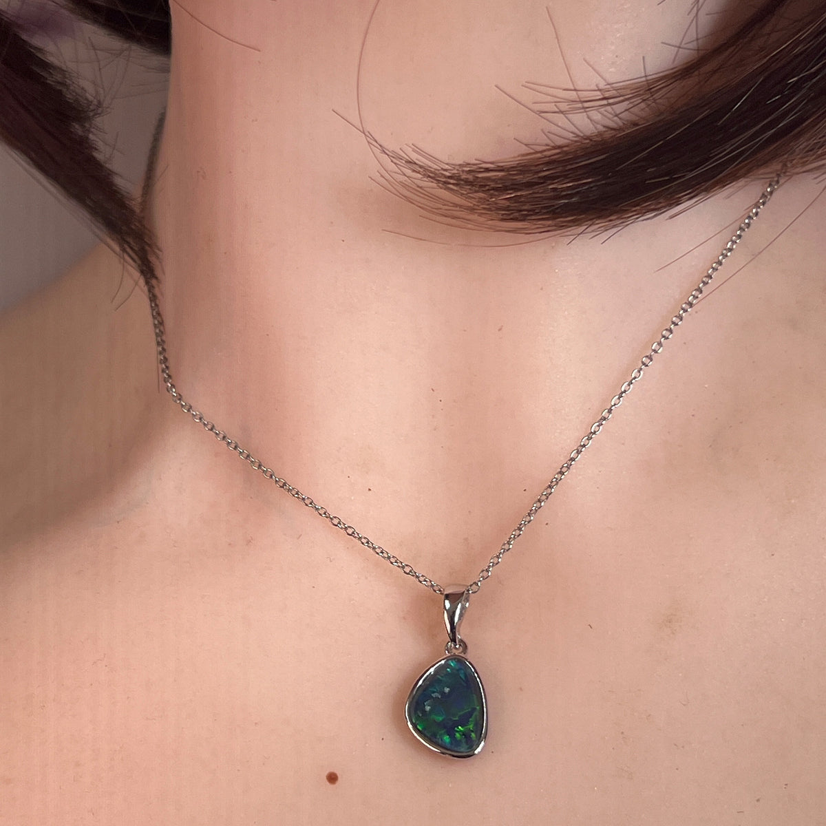freeform Australian opal triplet pendant in sterling silver, worn at the neck