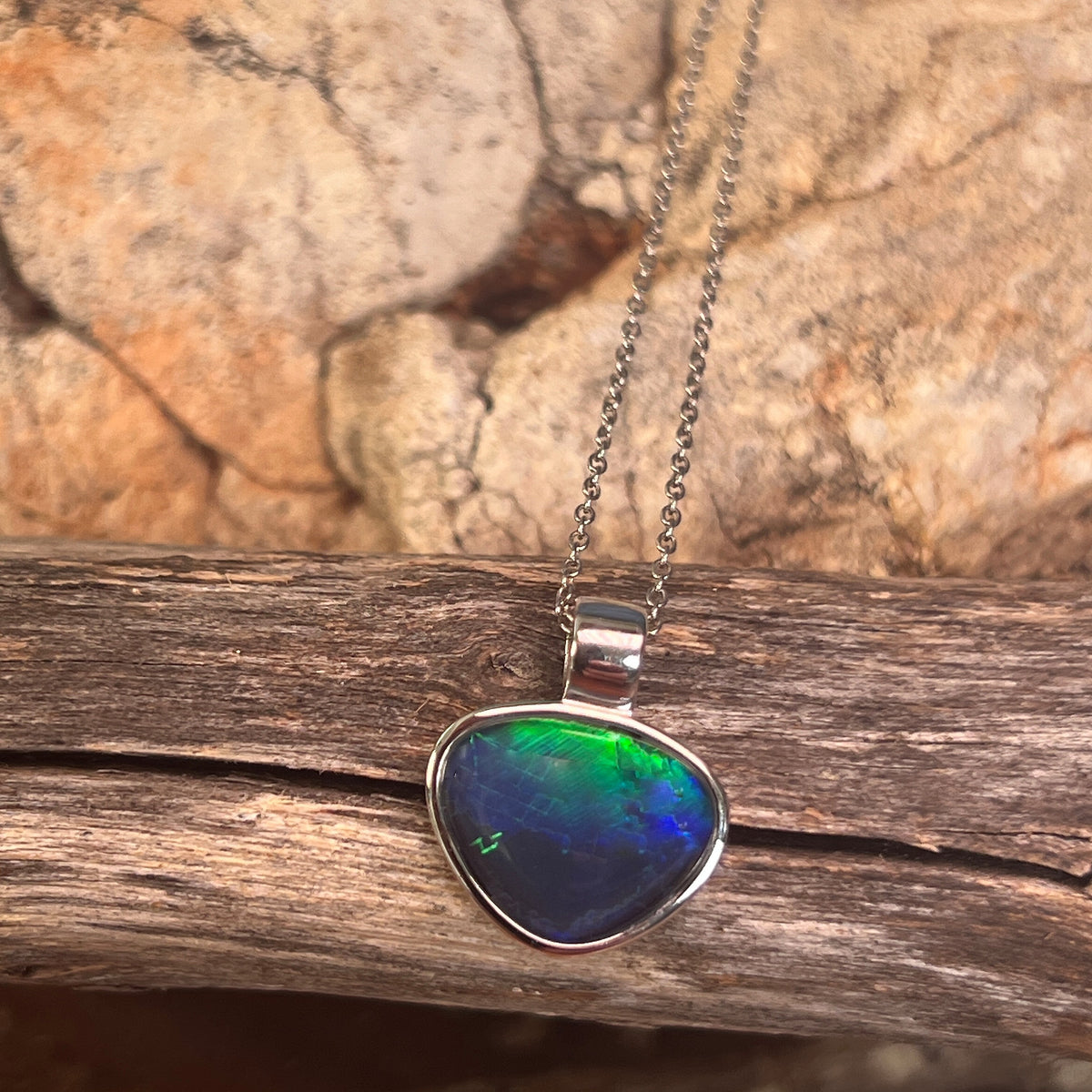 Australian opal triplet pendant, sterling silver, 12 x 15mm stone showing blue and green
