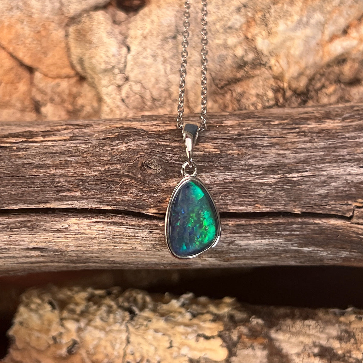 Australian opal triplet pendant, sterling silver, 12 x 8mm stone showing blue and green