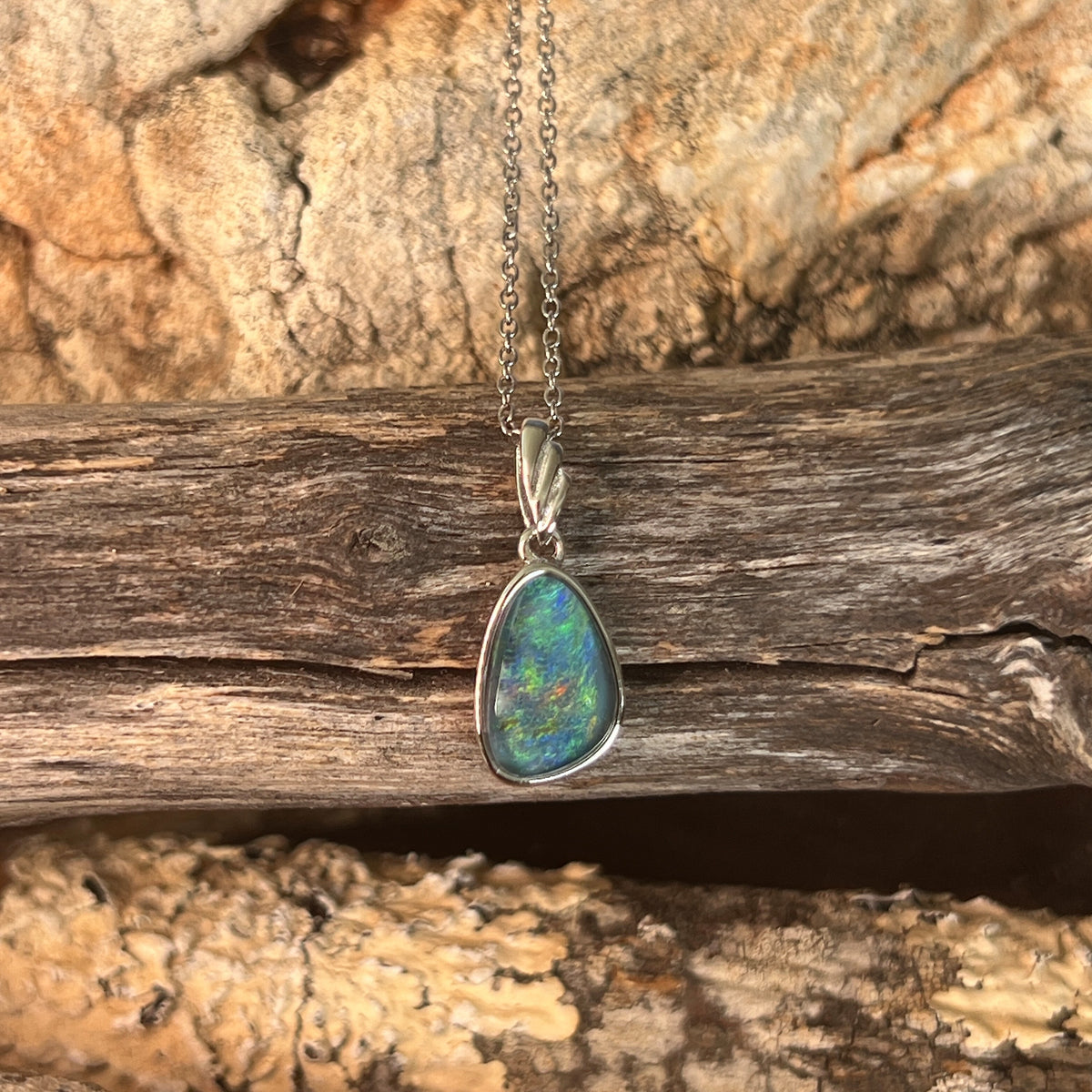 Australian opal triplet pendant, sterling silver, 12 x 8mm stone showing blue, green and yellow