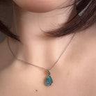 freeform Australian opal triplet pendant worn, sterling silver, blue, green and yellow