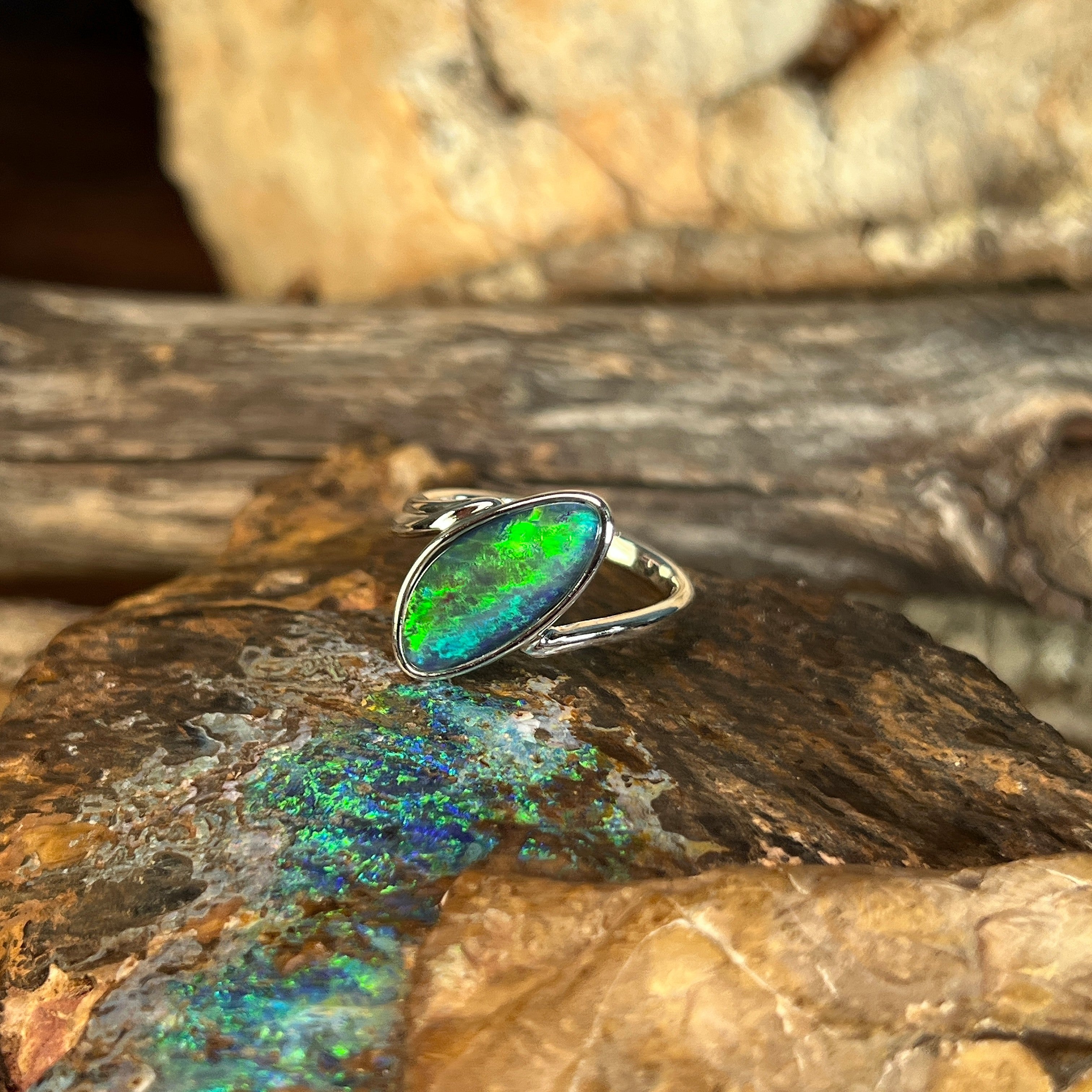 blue and green play-of-colour in a 16 x 7mm freeform Australian opal triplet ring