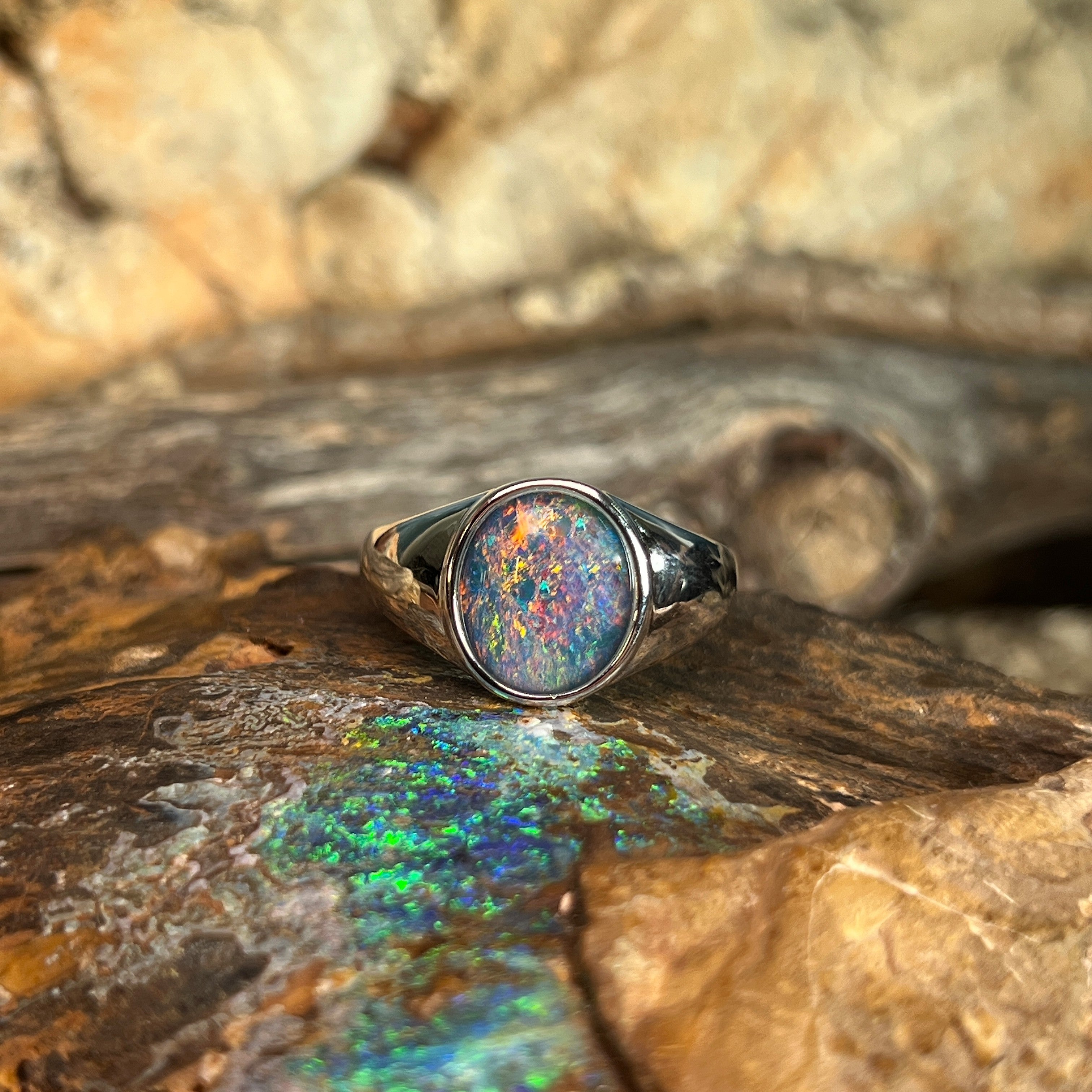 oval Australian opal triplet ring in sterling silver, red, blue and green play-of-colour