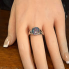 Australian opal triplet ring worn on the hand, red, blue and green play-of-colour