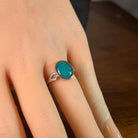 blue and green Australian opal triplet ring on the hand, sterling silver, 12 x 10mm