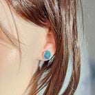 Worn Australian opal triplet earrings in sterling silver, blue and green, 11 x 9mm