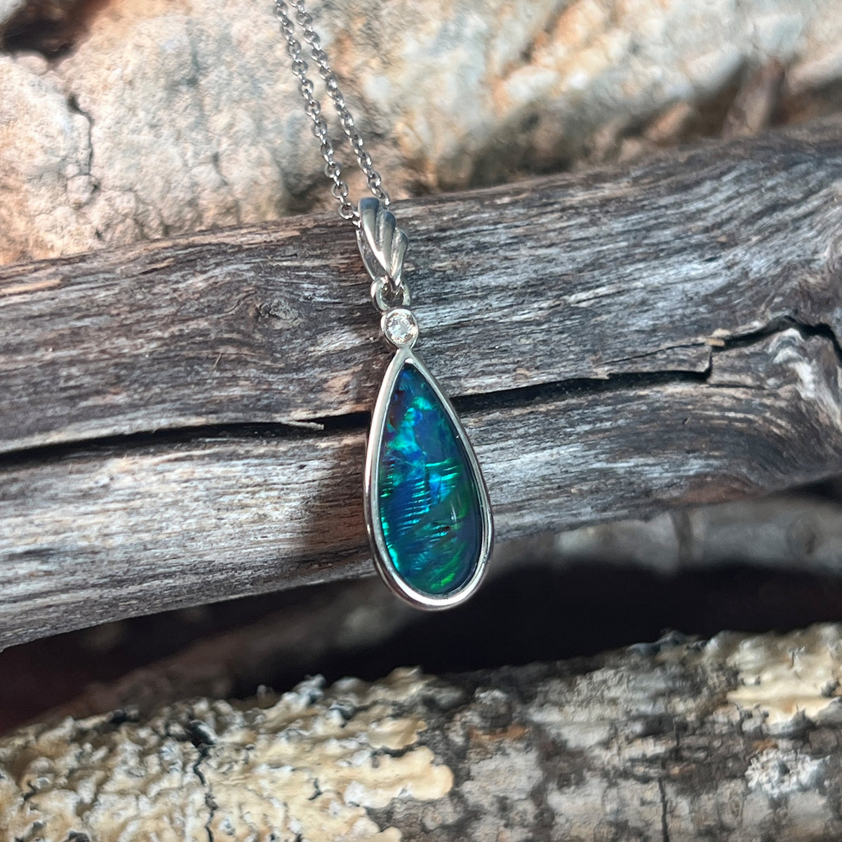sterling silver Australian opal triplet pendant with a 16 x 8mm pear-shaped stone