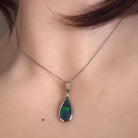 pear-shaped Australian opal triplet pendant in sterling silver, worn at the neck