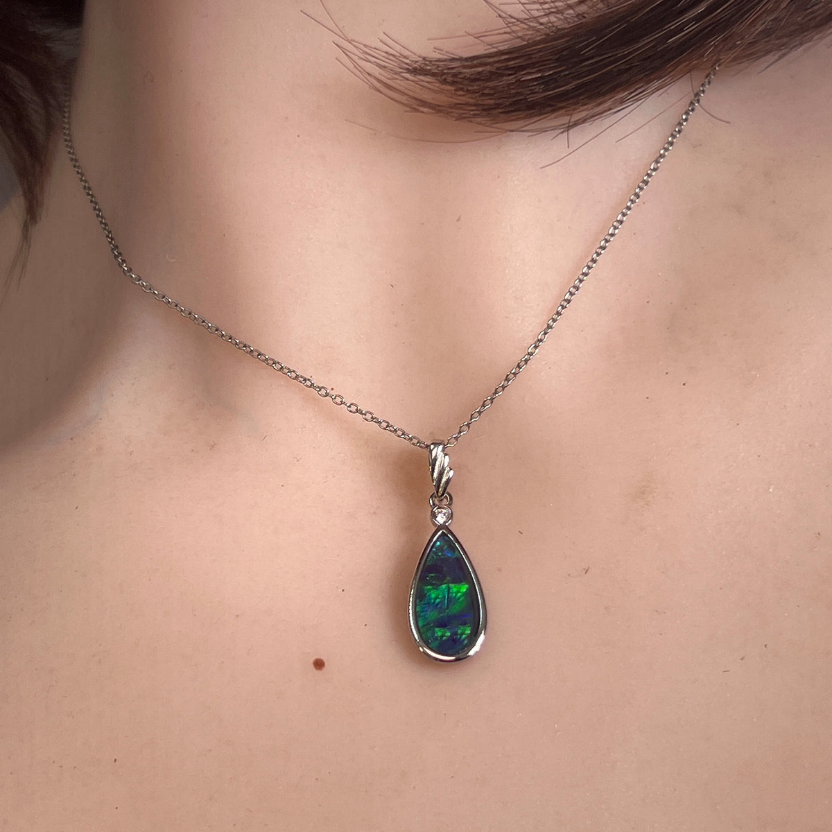 Worn Australian opal triplet pendant in sterling silver, blue and green, 16 x 8mm
