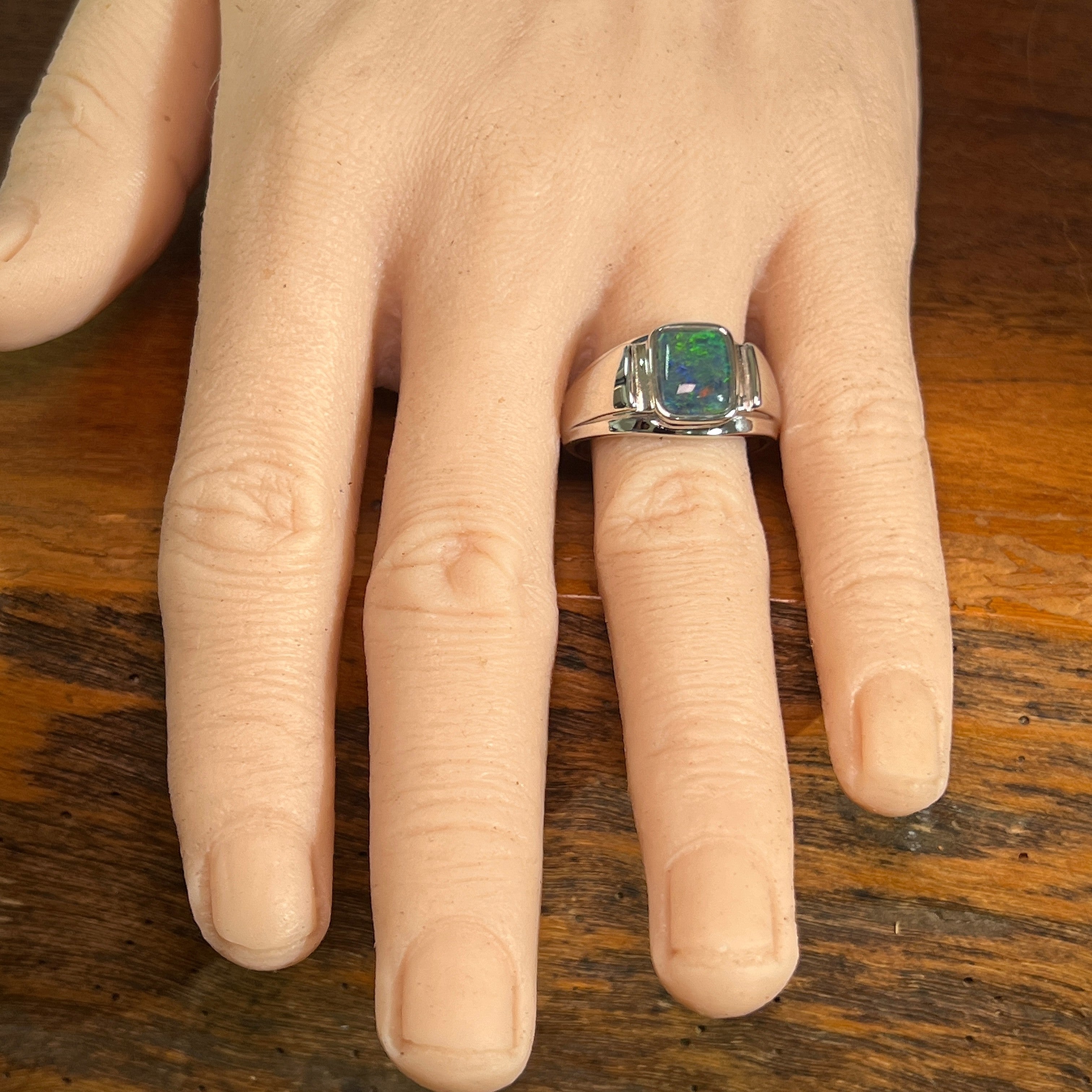 rectangular Australian opal triplet ring worn, sterling silver, yellow, blue and green