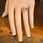 Australian opal triplet ring on the hand, sterling silver, 7mm round stone
