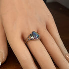 12 x 9mm triangular Australian opal triplet ring on the hand, sterling silver