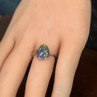 Australian opal triplet ring on the hand, sterling silver, 12 x 9mm triangular stone