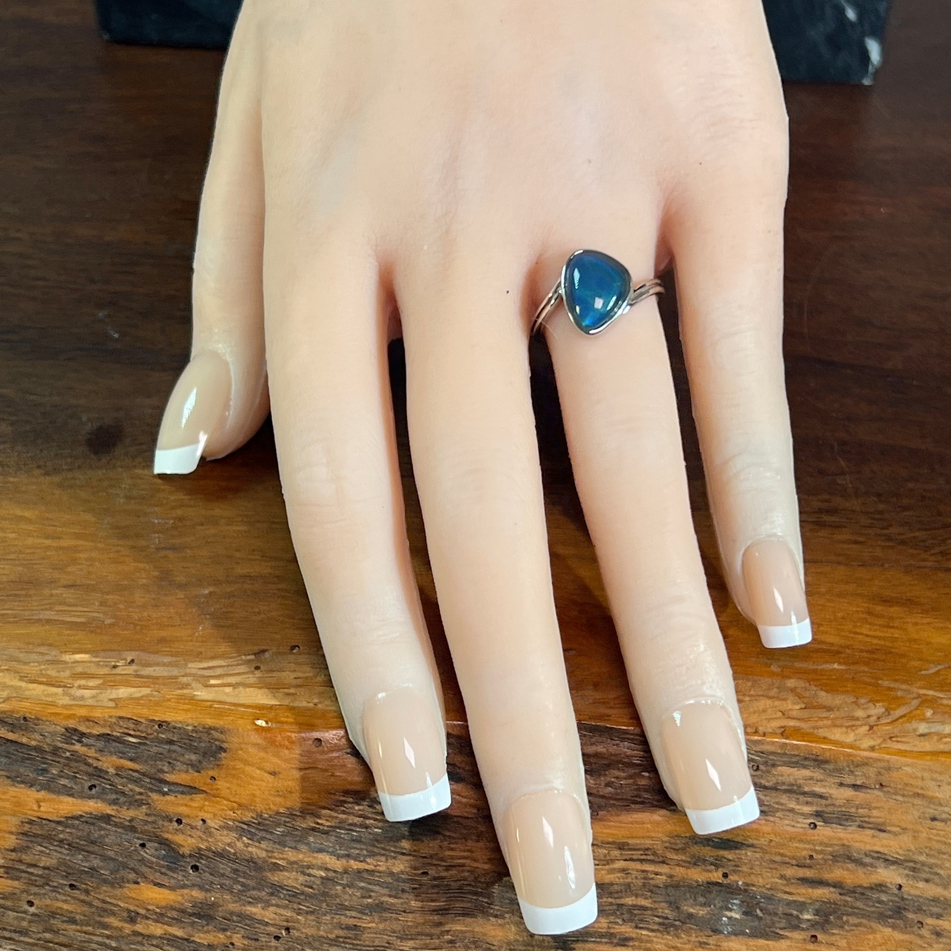 triangular Australian opal triplet ring worn, sterling silver, blue and green