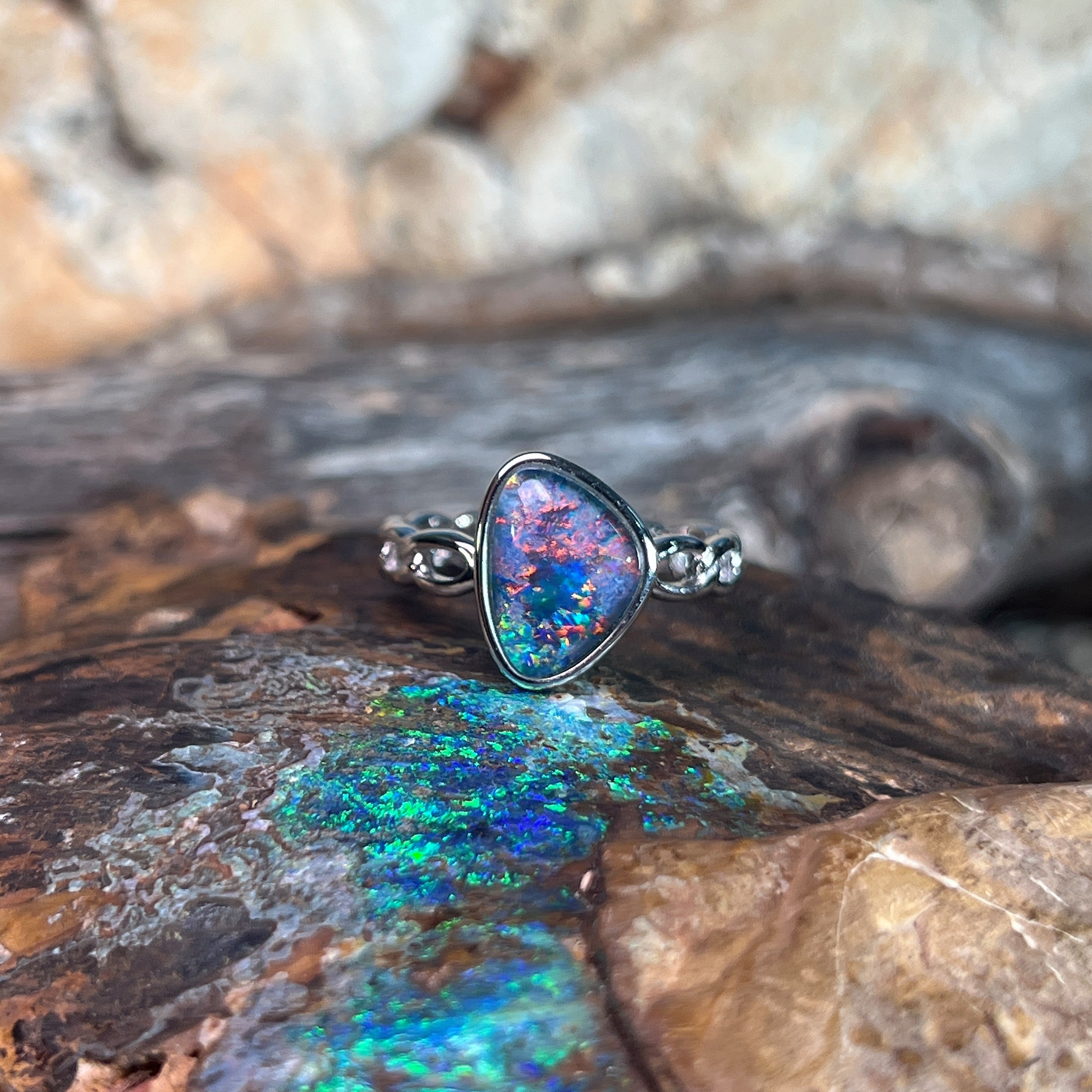 sterling silver Australian opal triplet ring with a 11 x 9mm triangular stone