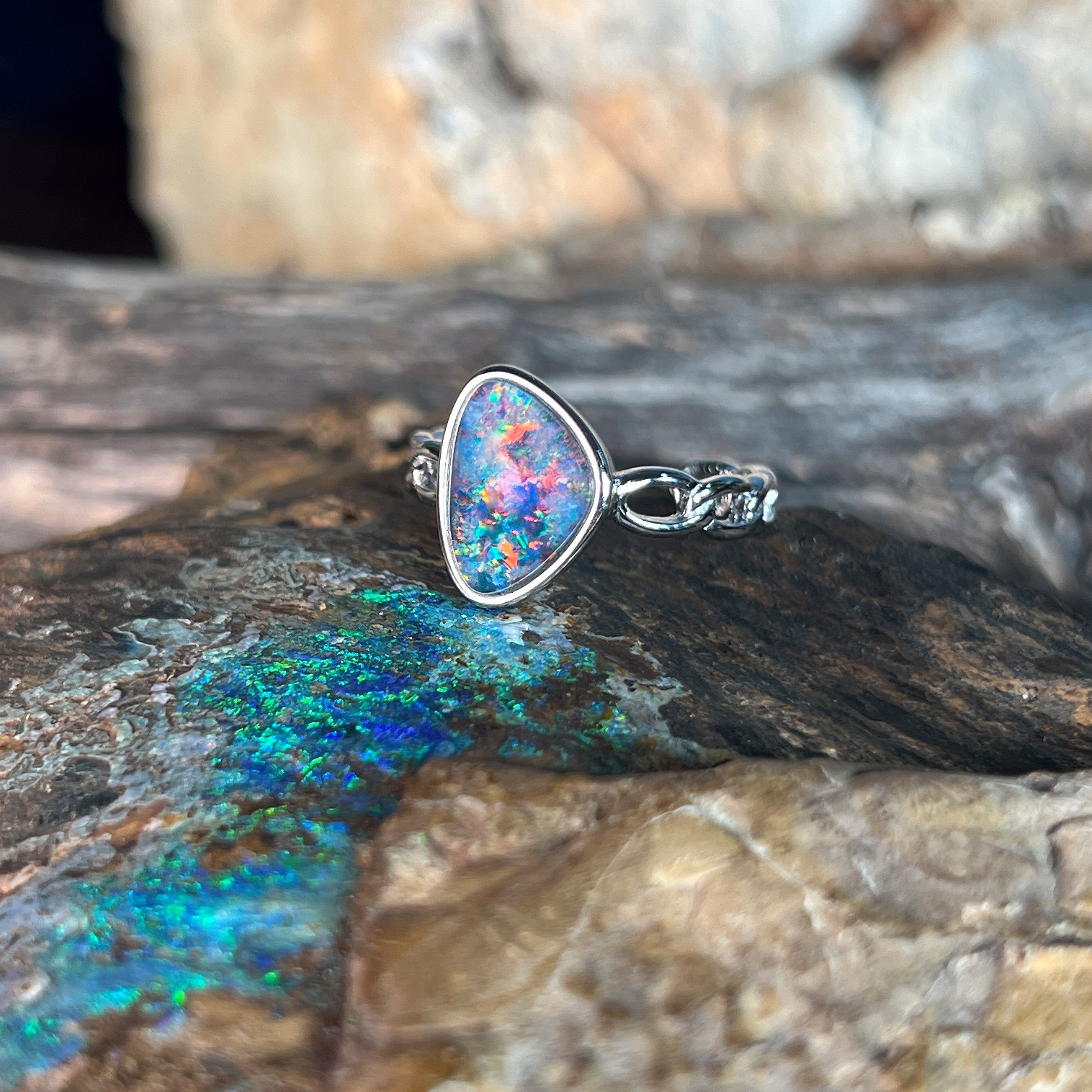 red, blue and green play-of-colour in a 11 x 9mm triangular Australian opal triplet ring