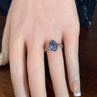 11 x 9mm triangular Australian opal triplet ring on the hand, sterling silver