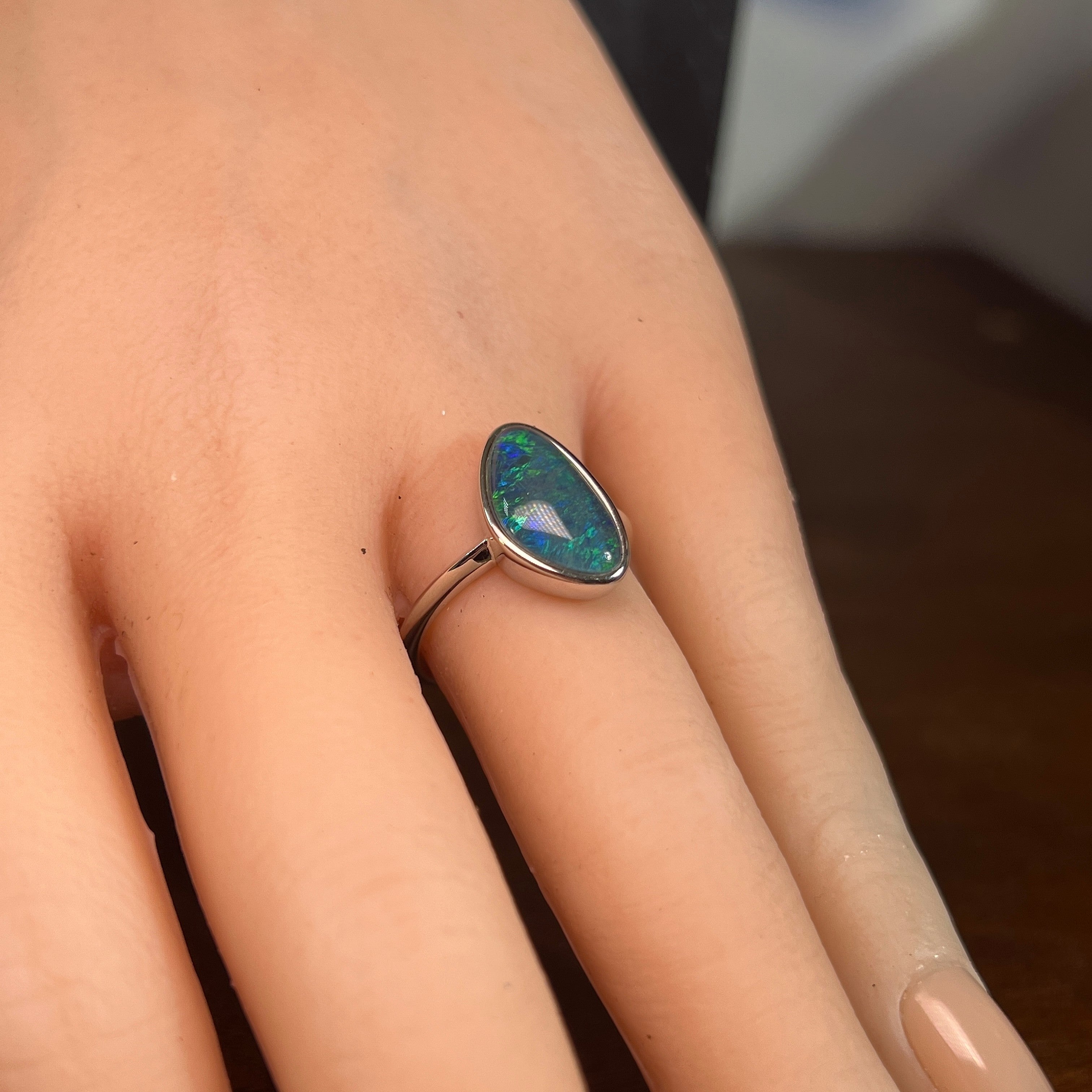 Australian opal triplet ring on the hand, sterling silver, 14 x 8.5mm triangular stone