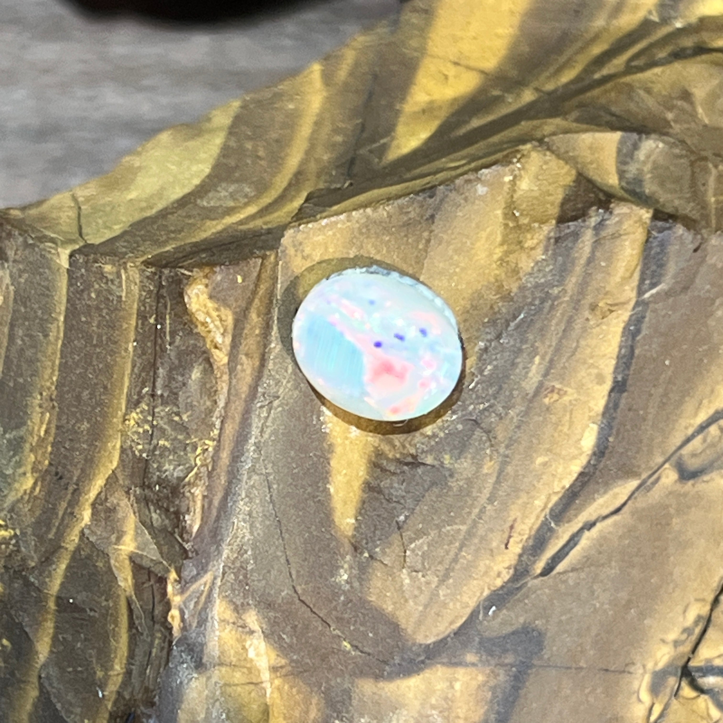 1.3ct Australian white opal, pink and blue flecks across a bright white body